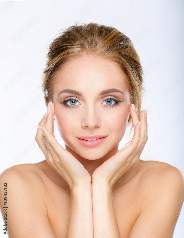Young woman touching her face isolated on white background Young woman touching her face isolated on white background