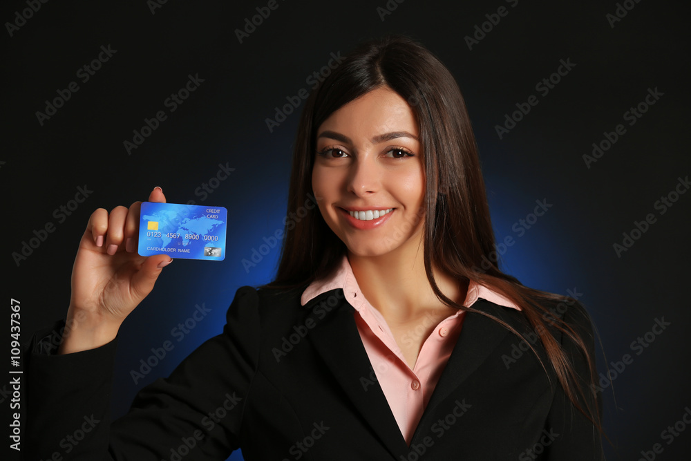 Businesswoman holding a credit card. Businesswoman holding a credit card.