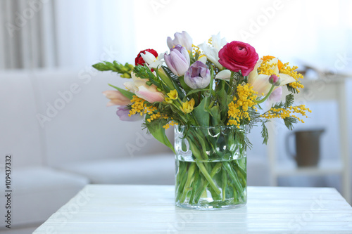A bouquet of fresh flowers in a glass vase.