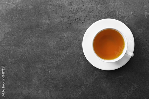 Cup of tea on grey background  top view