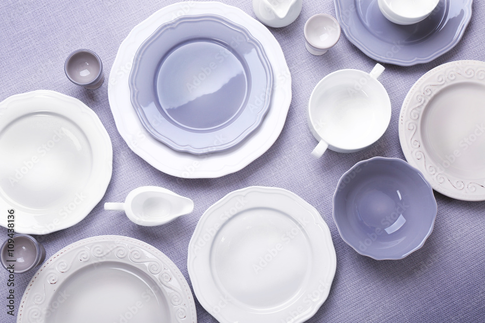 Empty dishes on grey background. Empty dishes on grey background.