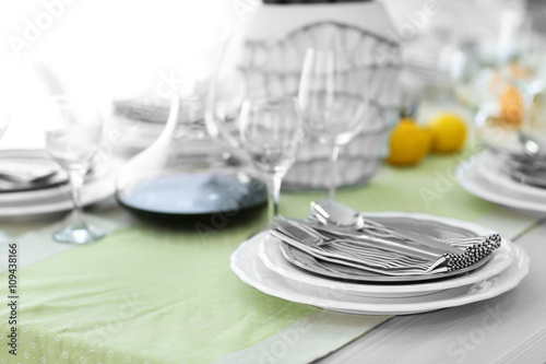 Table served with dishes and silver flatware