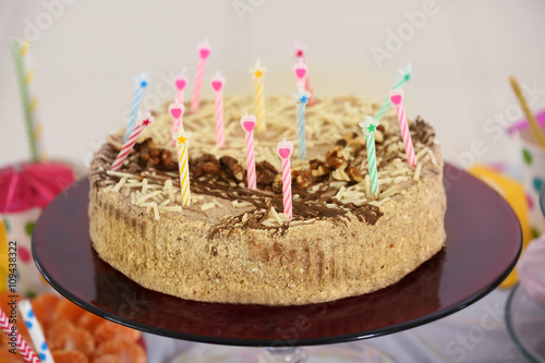 Tasty birthday cake with candles, close up