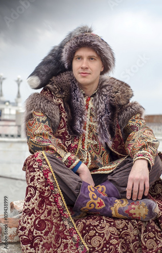 A tourist dressed of 16th century costume Khan at Qol Sharif mosque in Kazan. Russia photo