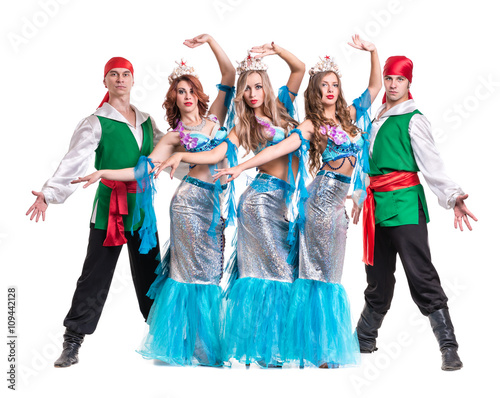 Carnival dancer team dressed as mermaids and pirates. Isolated on white background in full length.