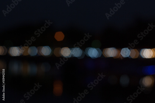 Abstract, Bokeh hexagon of the night light. Bokeh lights in a row. © kunpisit