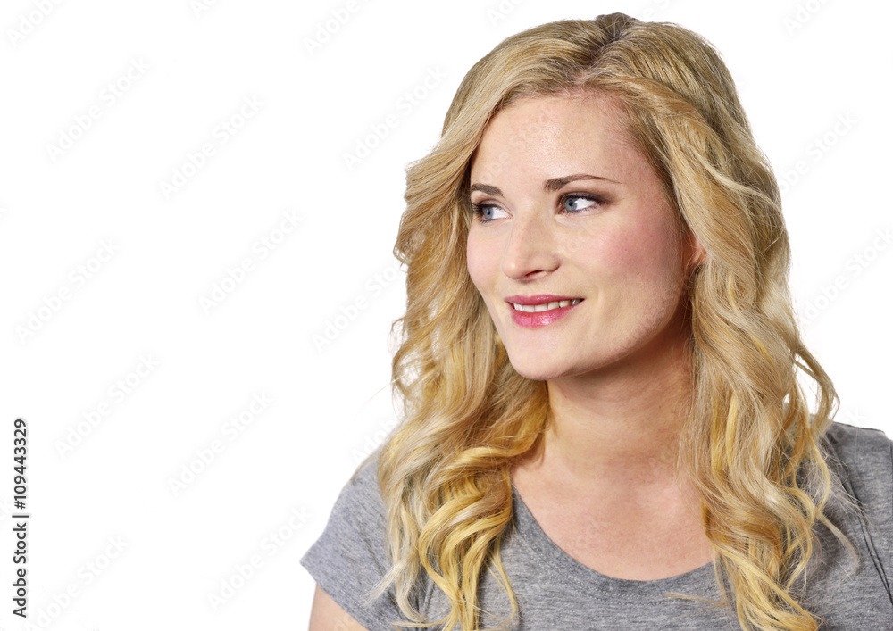 Beautiful blond woman looking to the side. Positive Emotions. Young, laughing woman with copy space, isolated on white background. Beautiful blond woman looking to the side. Positive Emotions. Young, laughing woman with copy space, isolated on white background.