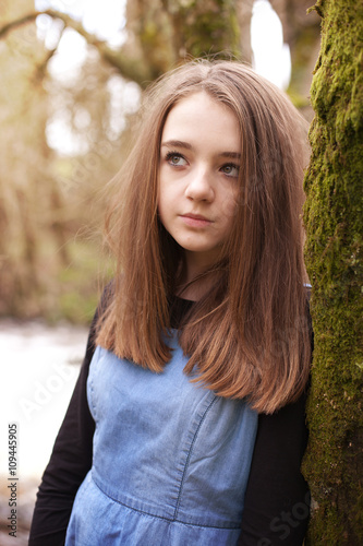 Pretty teenage girl looking upwards