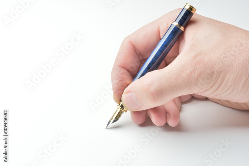 pen in the man's hand to signature