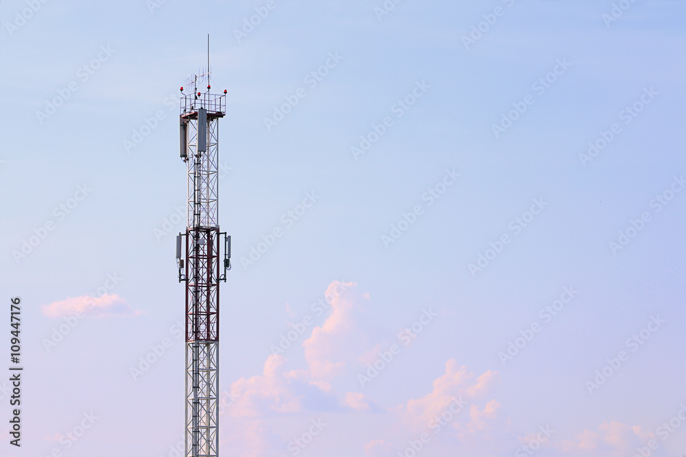Tall modern cell tower, clouds and beautiful sky at summer Tall modern cell tower, clouds and beautiful sky at summer