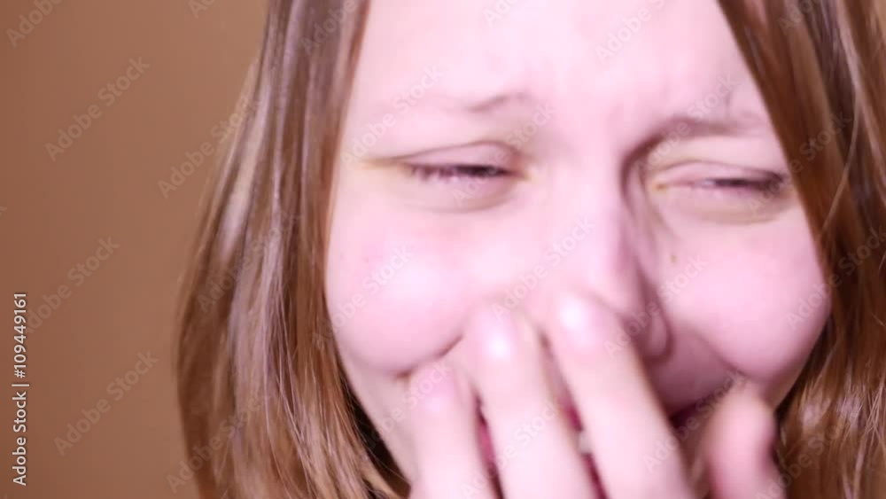 Closeup portrait of an emotional attractive laughing teen girl. 4K UHD Closeup portrait of an emotional attractive laughing teen girl. 4K UHD