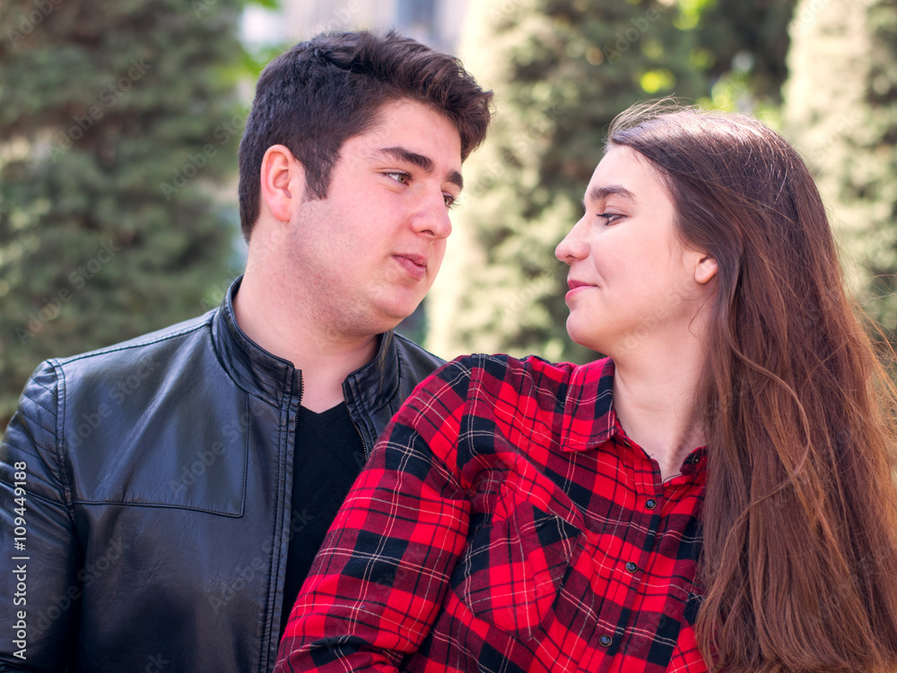 young beautiful couple relaxing outdoors