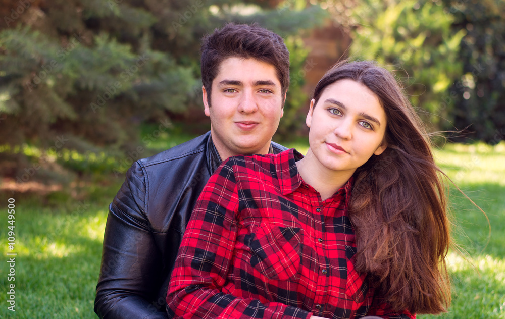 young beautiful couple relaxing outdoors young beautiful couple relaxing outdoors