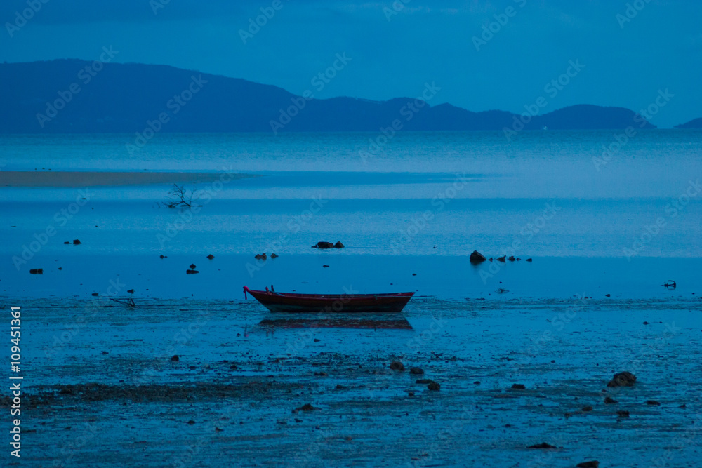 Obraz premium Picture of empty long tail boat on tropical beach at night. Ko li pe island. Horizontal
