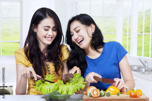 Healthy women making salad