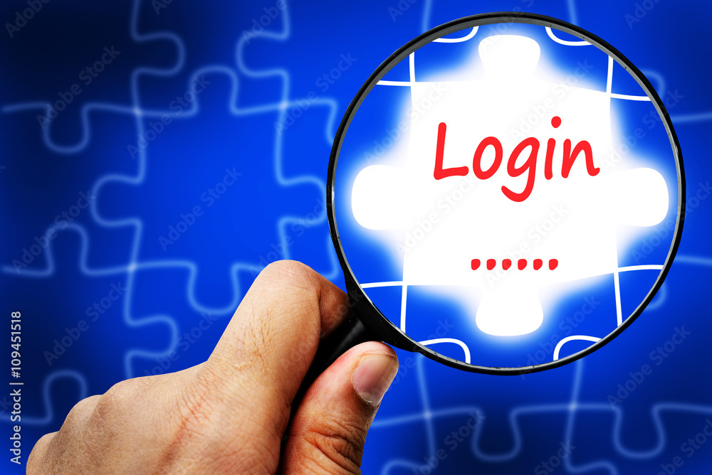 Obraz premium Login word. Magnifier and puzzles.
