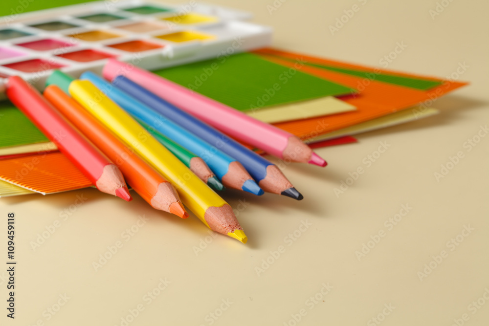 school supplies on plain beige background school supplies on plain beige background
