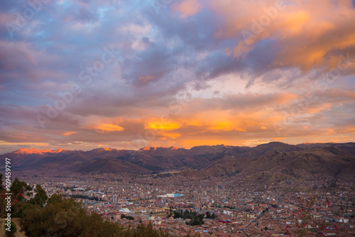 Cityscape of Cusco and cloudscape at dusk, Peru