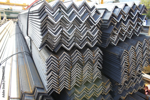Steel angles. Stuck og L-beams on the warehouse. Metal rolled angle bar.