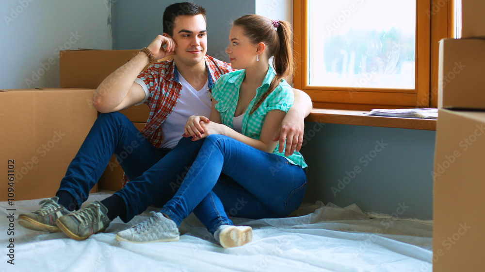 Fototapeta premium Portrait of young couple moving in new home