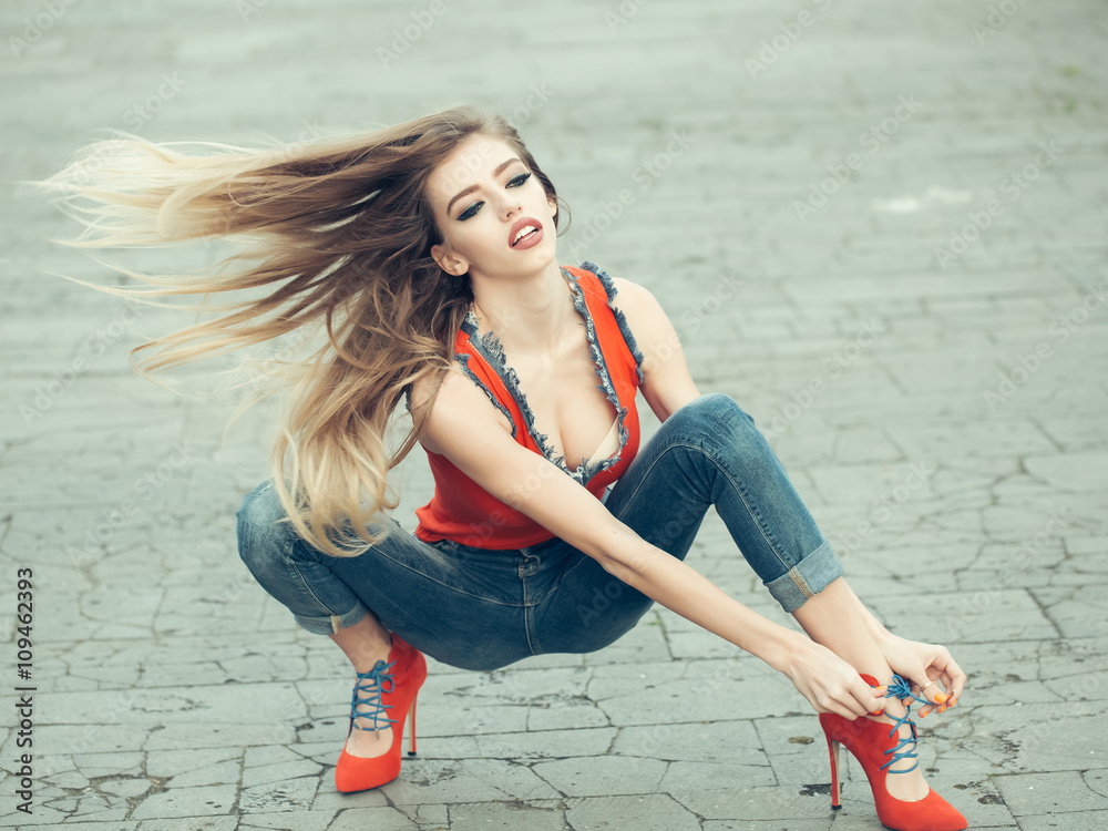 Beautiful and sexy girl sits in high heel shoes Stock Photo | Adobe Stock