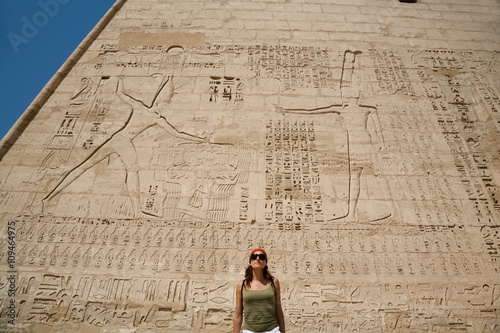 woman in facade of Medinet Habu Temple photo