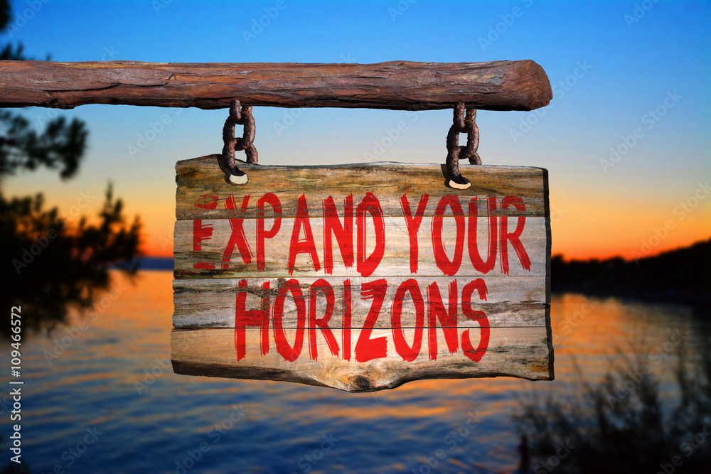 Fototapeta premium Expand your horizons motivational phrase sign