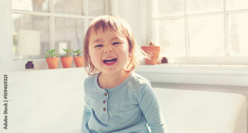 Happy toddler smiling in her house Happy toddler smiling in her house