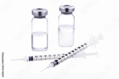 Syringes and bottles kits isolated on white photo