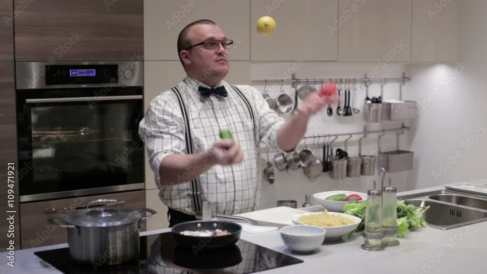 A man juggles vegetables A man juggles vegetables
