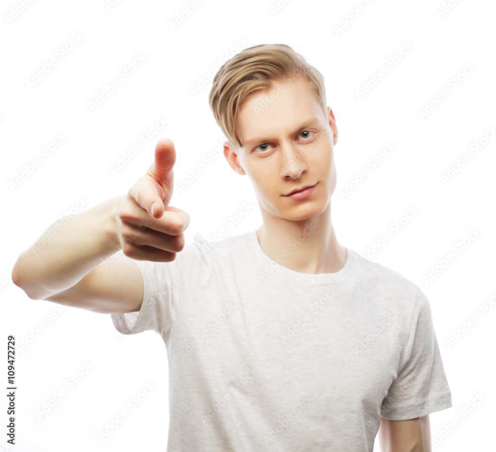 Young happy man with good idea sign in casuals looking at camera Young happy man with good idea sign in casuals looking at camera