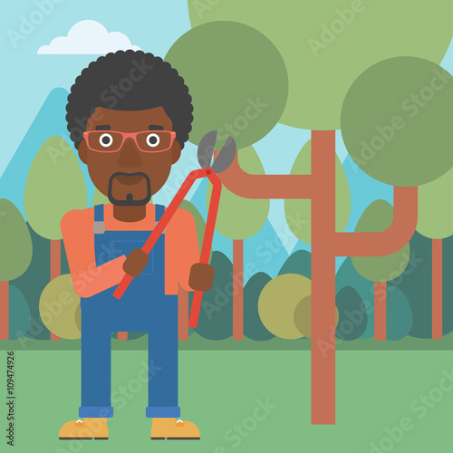 Farmer with pruner in garden.