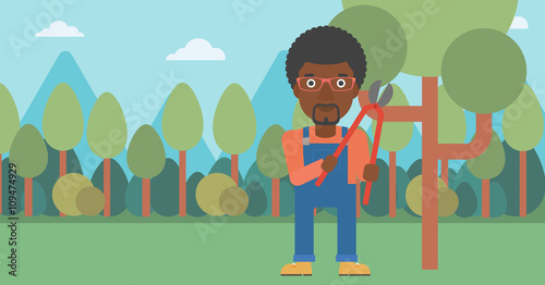 Farmer with pruner in garden.