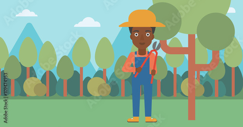 Farmer with pruner in garden.