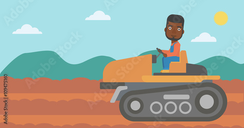 Farmer driving tractor.