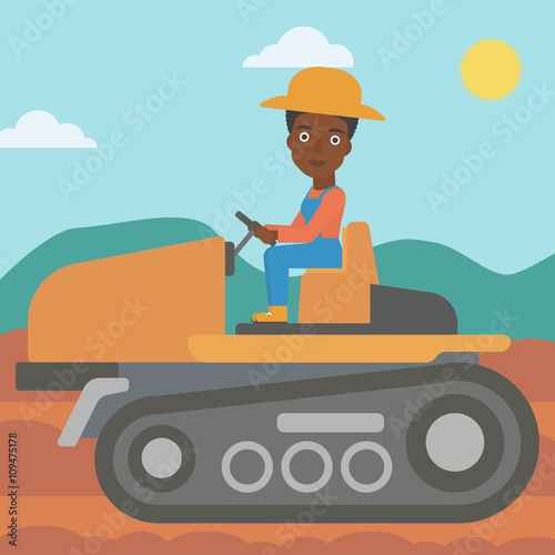 Farmer driving tractor.
