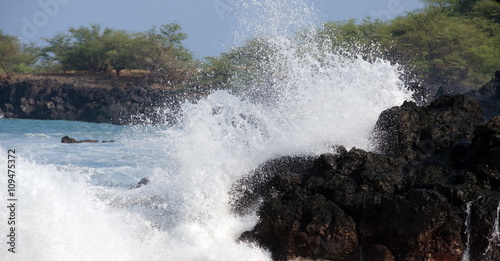 Morning surf breaks on rocks of Puako beach - 3 photo