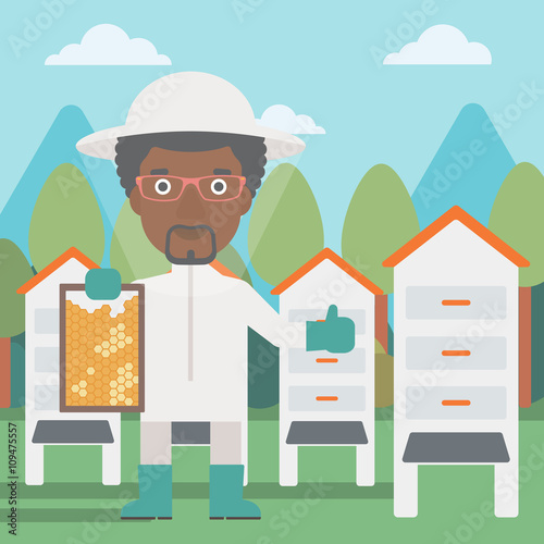 Bee-keeper at apiary.