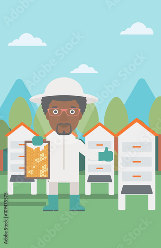 Bee-keeper at apiary.