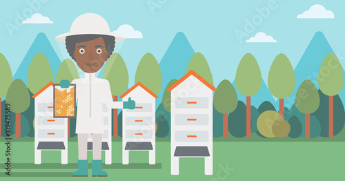 Bee-keeper at apiary.