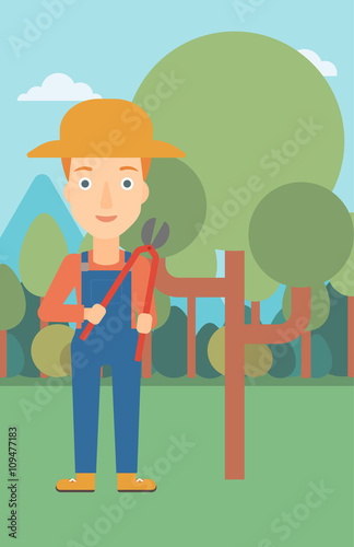 Farmer with pruner in garden.