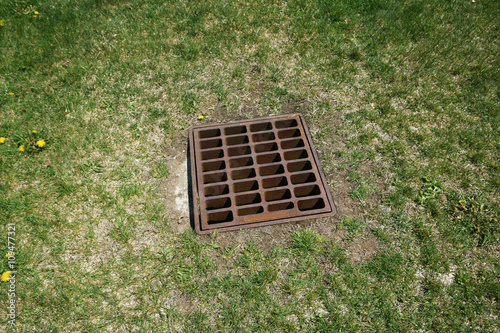 sewer grate on the lawn for heavy rain