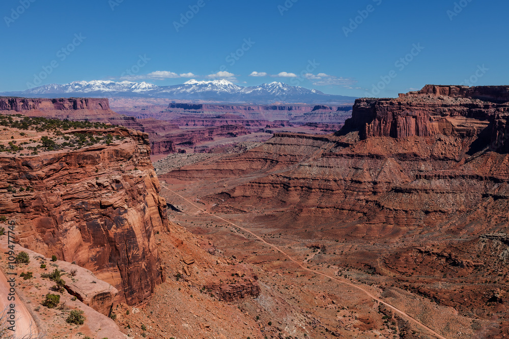 Utah-Canyonlands National Park-Island in the Sky District. This area of Island in the Sky affords one spectacular views of the Manti la Sal Mountains and the White Rim Road below