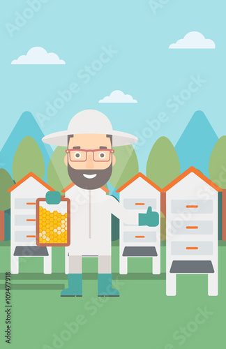 Bee-keeper at apiary.
