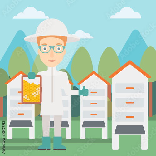 Bee-keeper at apiary.