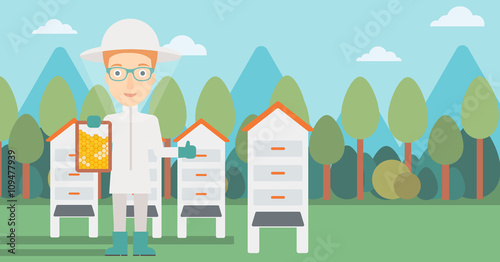 Bee-keeper at apiary.