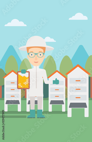 Bee-keeper at apiary.