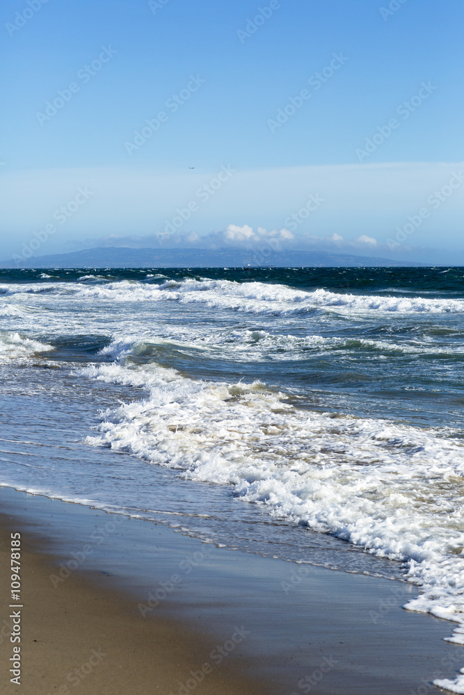 Pacific ocean is clear day. Beach landscape in the USA with the blue sea, Santa Monica. Pacific ocean is clear day. Beach landscape in the USA with the blue sea, Santa Monica.