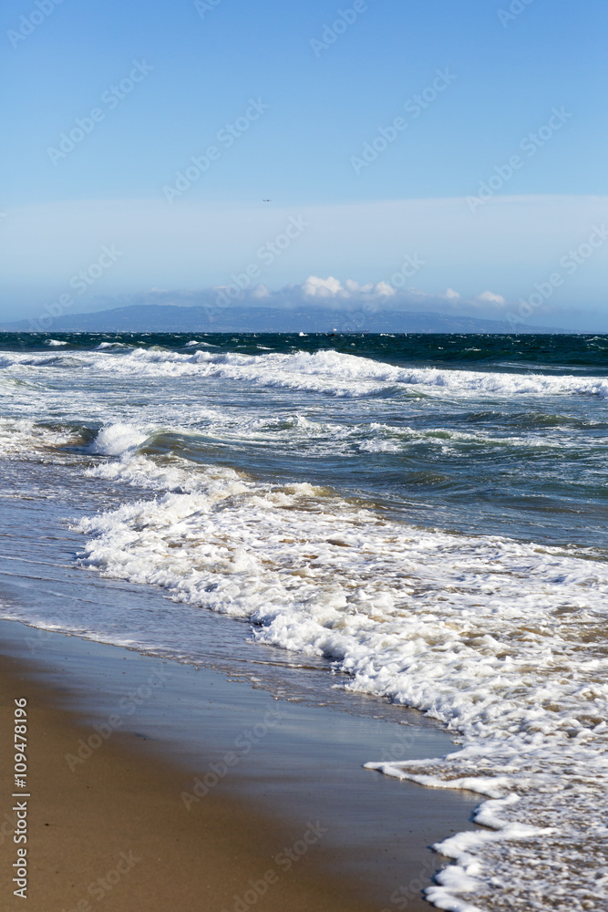 Pacific ocean is clear day. Beach landscape in the USA with the blue sea, Santa Monica. Pacific ocean is clear day. Beach landscape in the USA with the blue sea, Santa Monica.