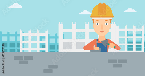 Bricklayer with spatula and brick.